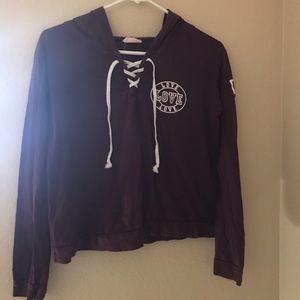 maroon long sleeve top.